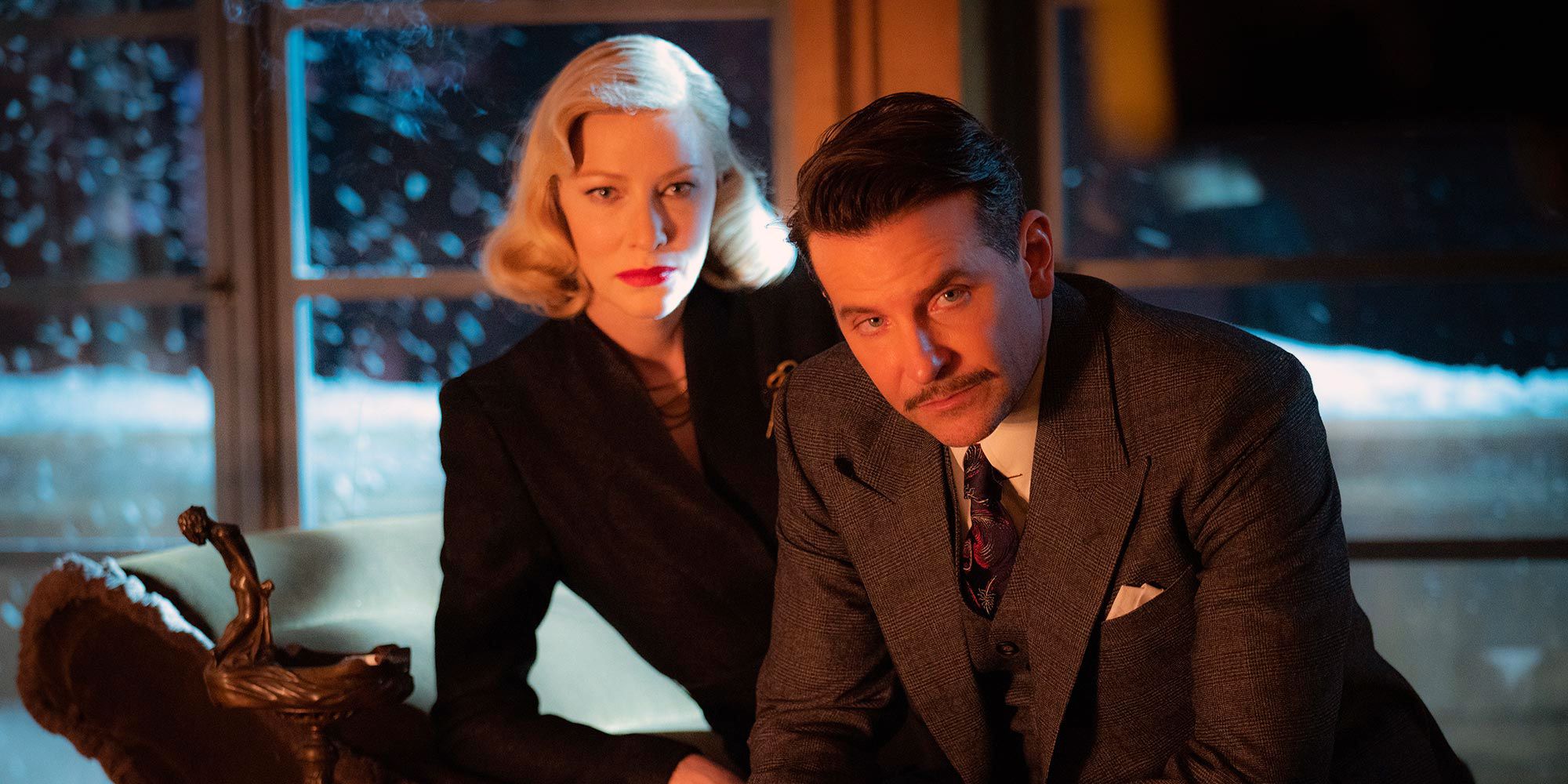 Cate Blanchett and Bradley looking at the camera in Nightmare Alley.