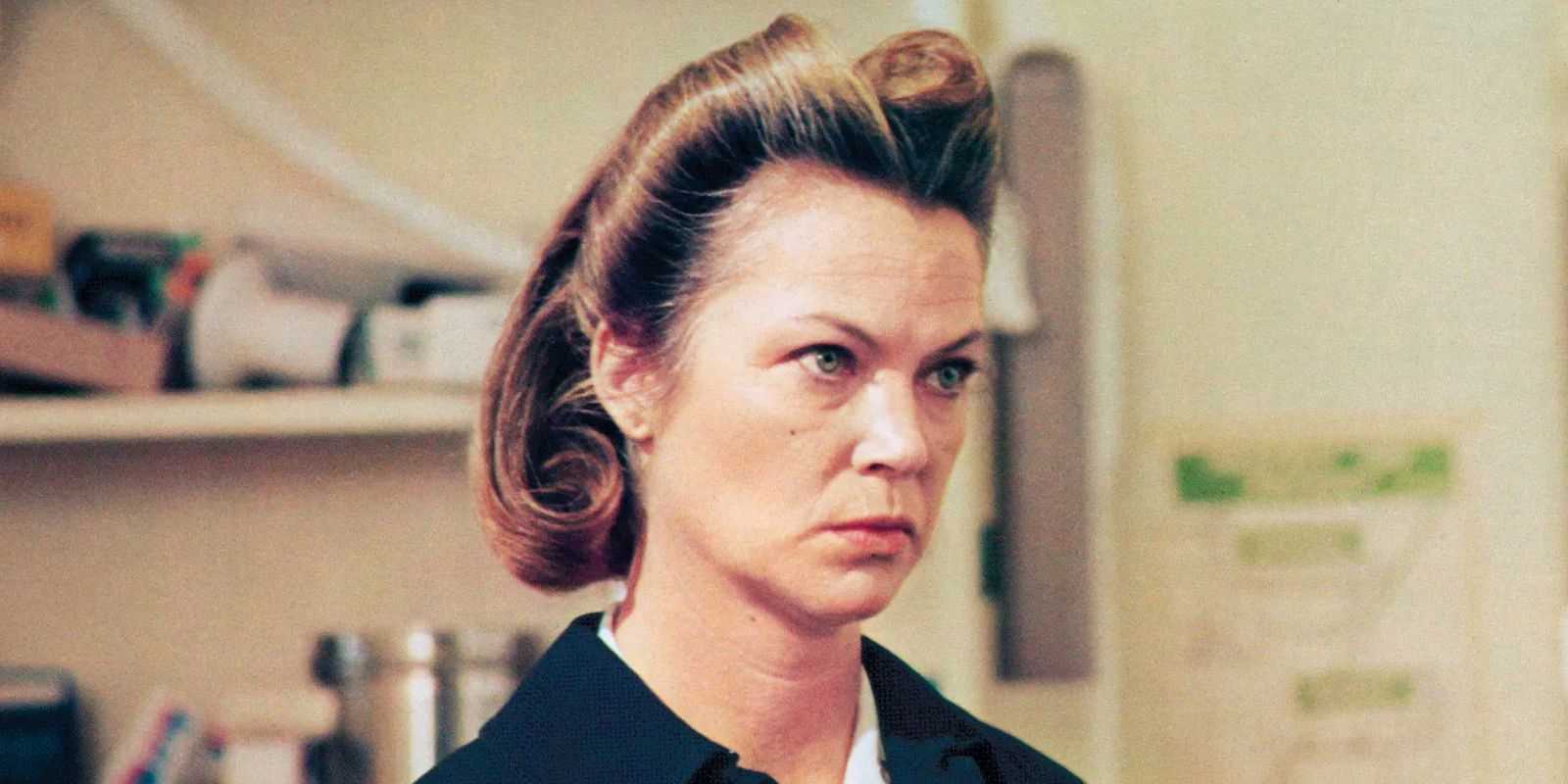 Nurse Ratched looking at something off-camera with an angry look on her face.