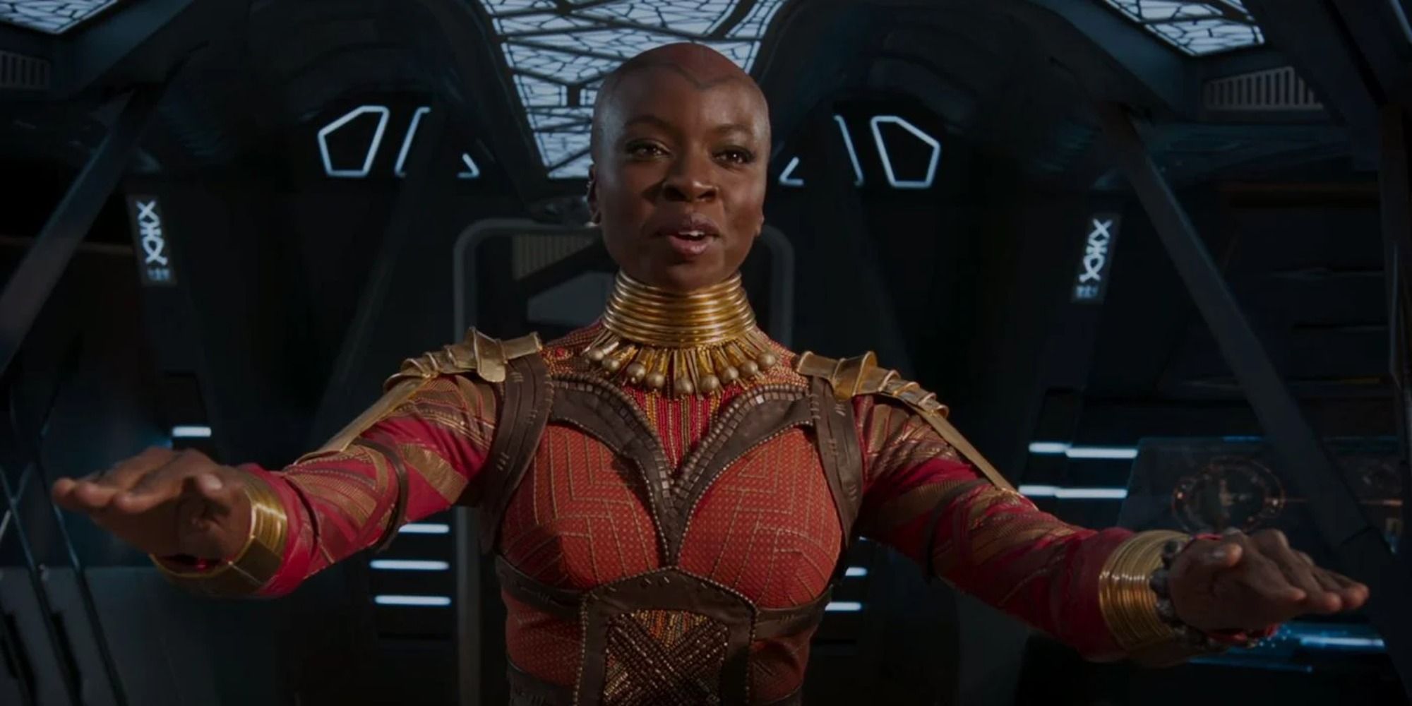 Okoye smiling and sitting in the middle of the ship 