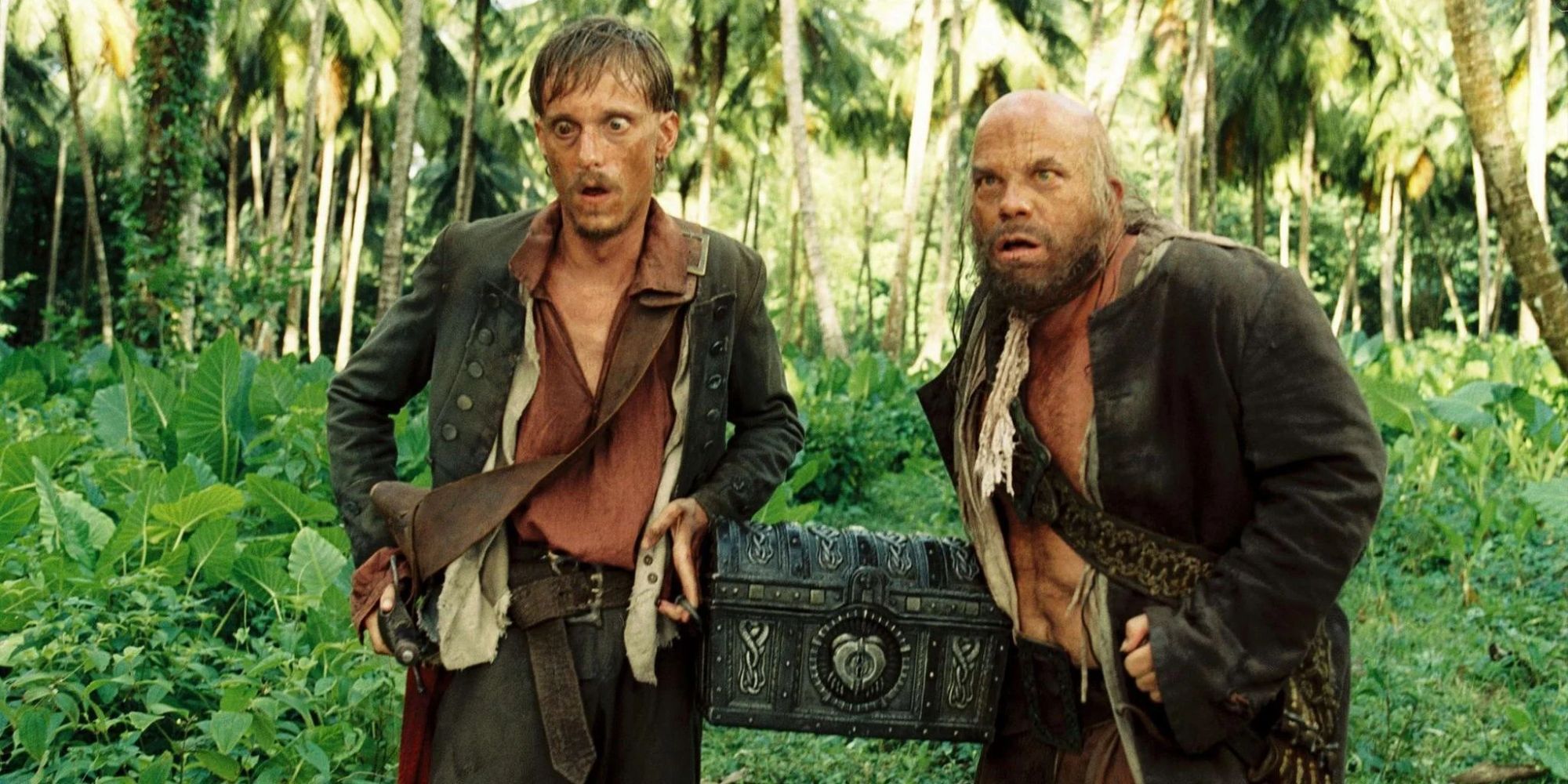 Pintel and Ragetti standing in the jungle looking confused in 'Pirates of the Caribbean.'