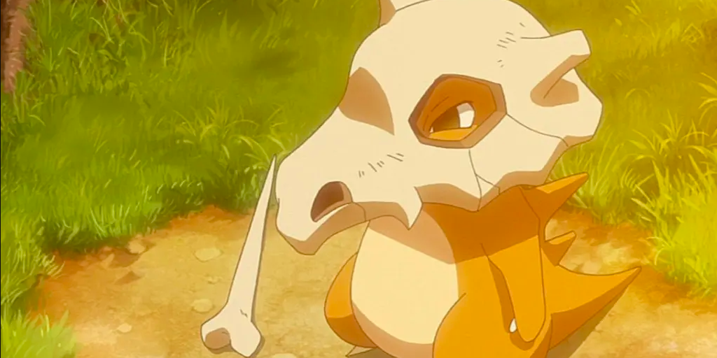 Lonely Cubone stands on a path, with its bone laying in the dirt beside him in Pokemon.