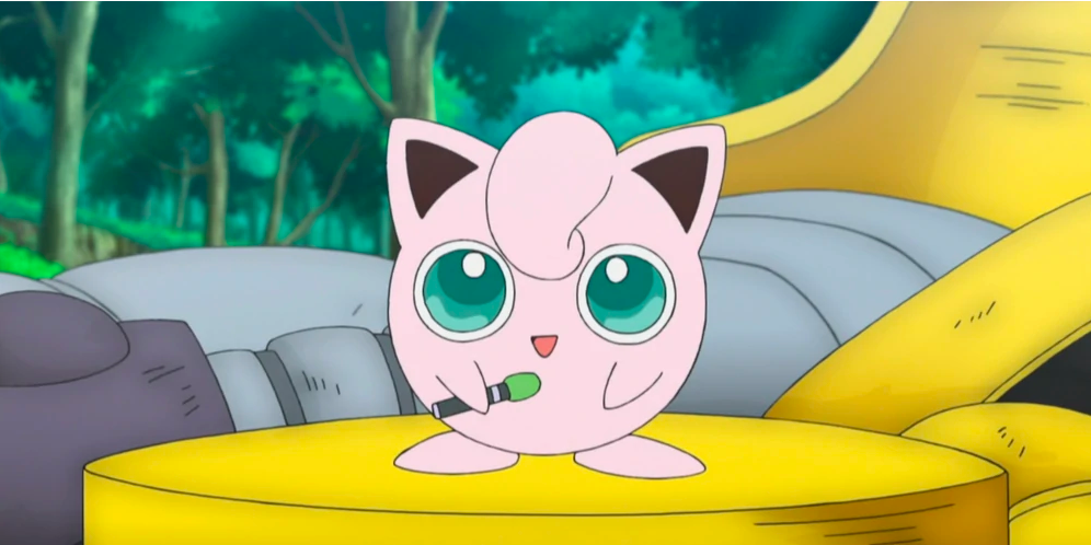 Jigglypuff stands on a yellow stage, holding a microphone in Pokemon.