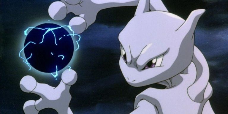 Mewtwo conjures a dark blue orb between its hands in Pokemon The First Movie