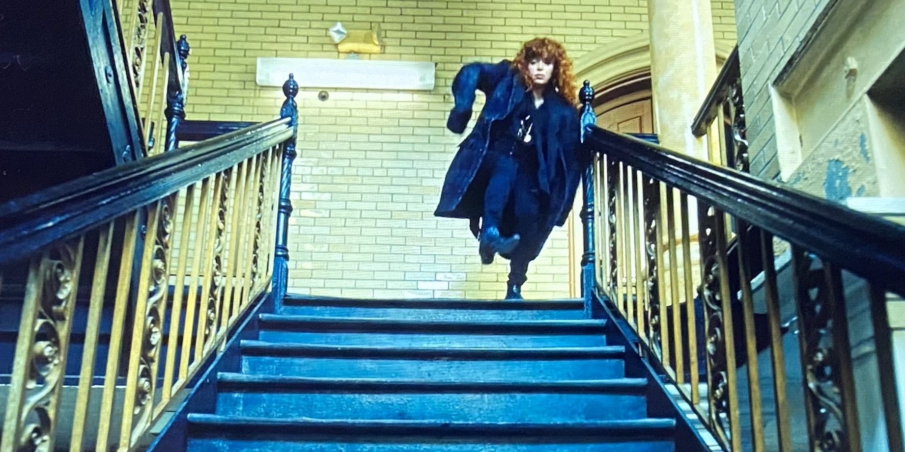 Natasha Lyonne walking down a flight of stairs in 'Russian Doll'