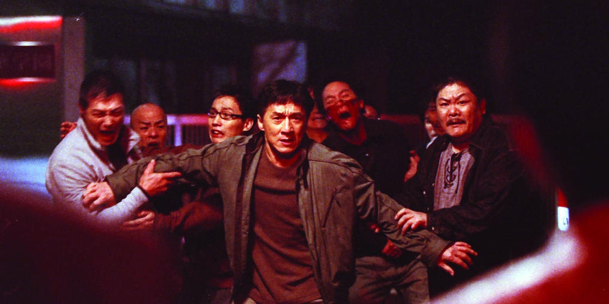 Jackie Chan defending his character's comrades in Shinjuku Incident (2009)