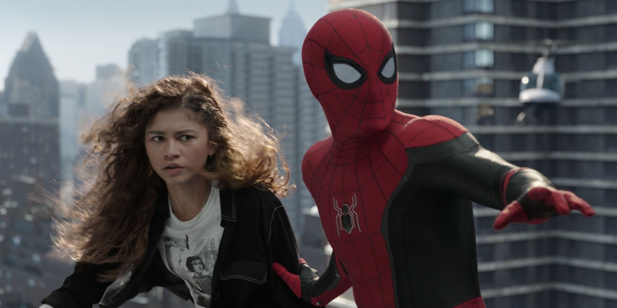 Spider-Man with MJ (Zendaya) during an action scene