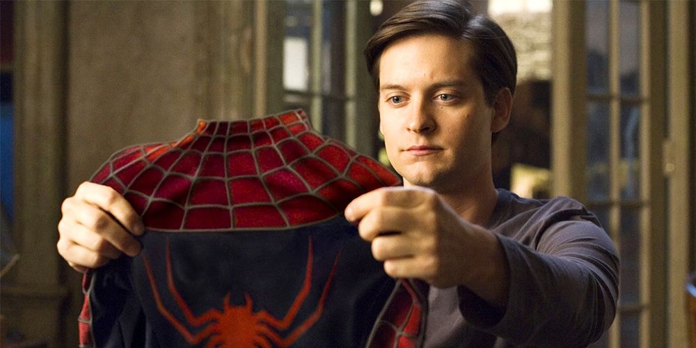 A contemplative Spider-man played by Tobey Maguire in Spider-man3