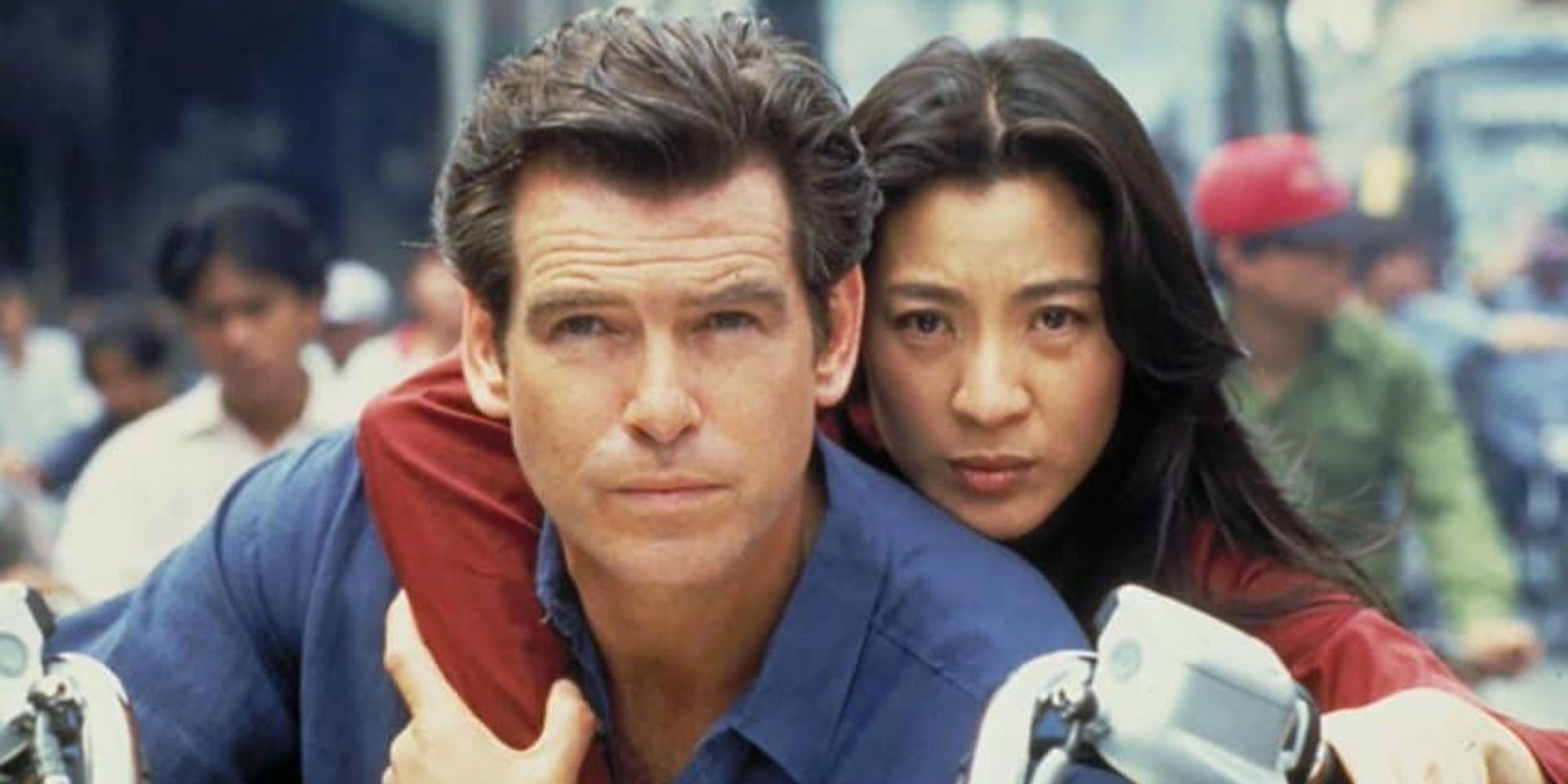 James Bond and Mai Lin on a motorbike looking ahead in Tomorrow Never Dies