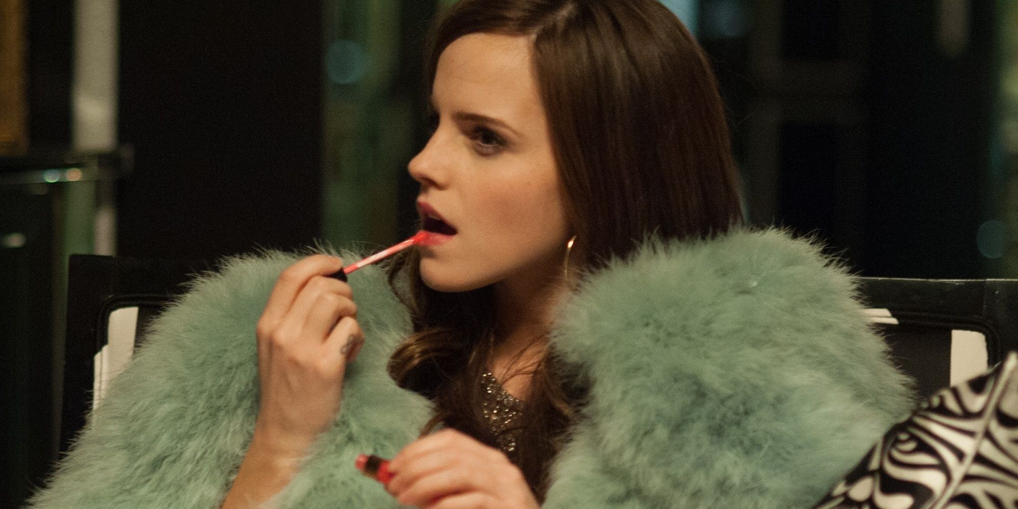 Emma Watson applying lipgloss in The Bling Ring.