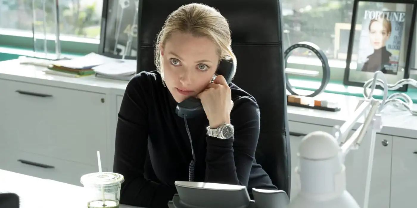 Elizabeth Holmes on the phone looking serious in The Dropout