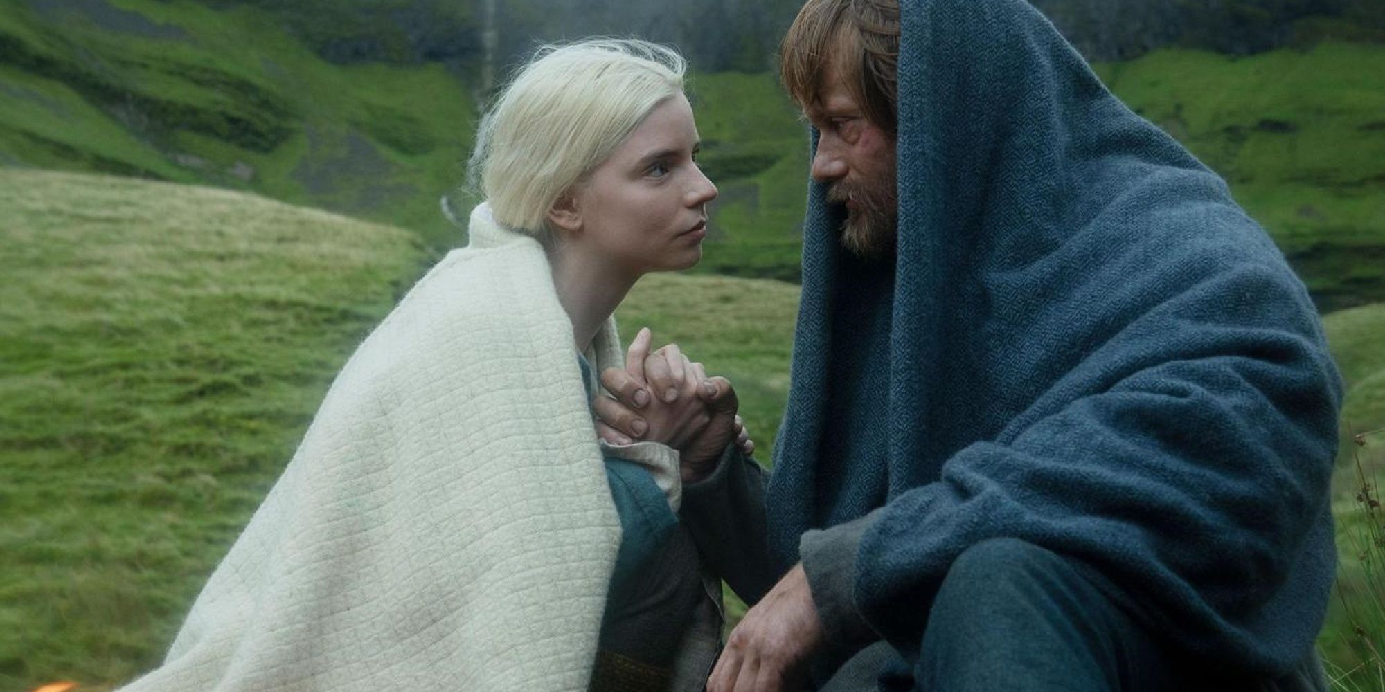 Anya Taylor-Joy as Olga and Alexander Skarsgard as Amleth stare into each other's eyes lovingly in The Northman
