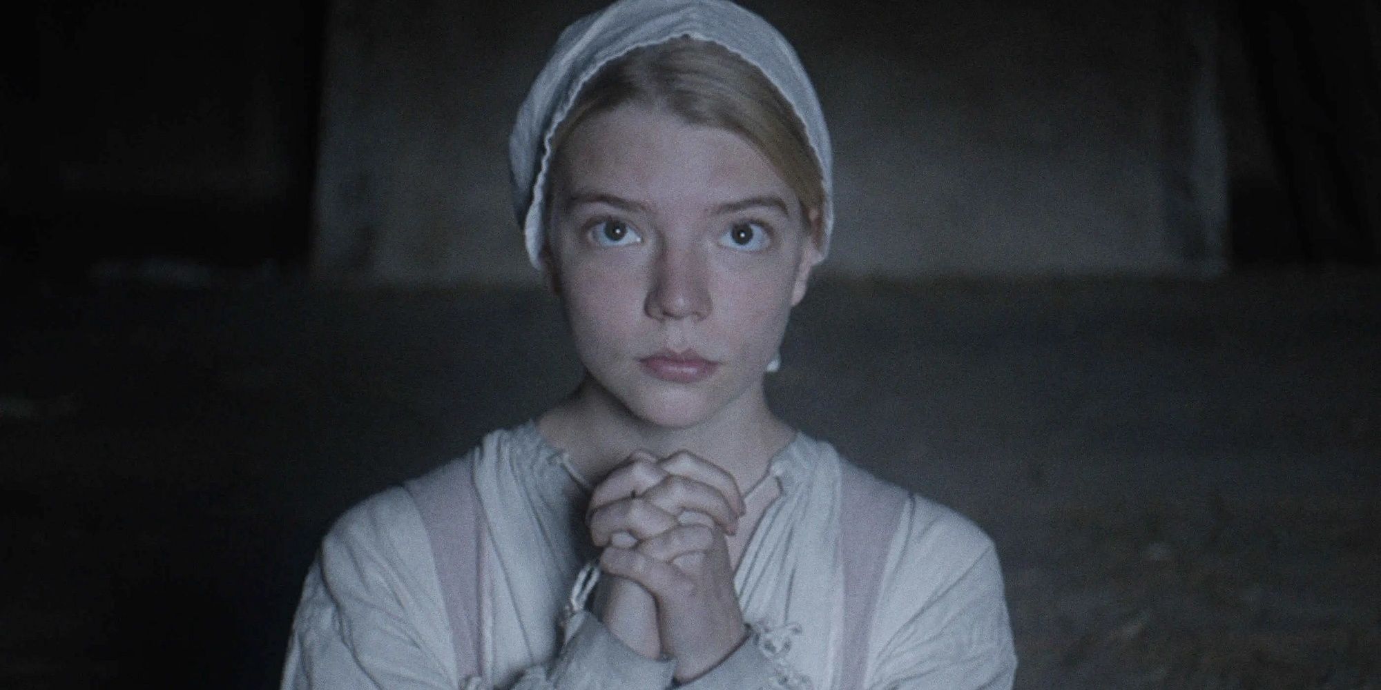 Thomasin prays at the beginning of The Witch.