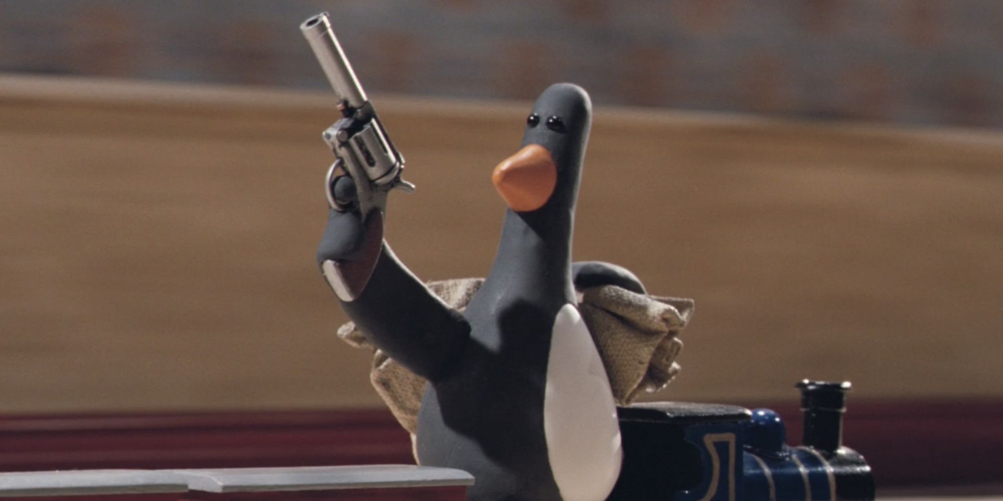 A penguin holding a gun