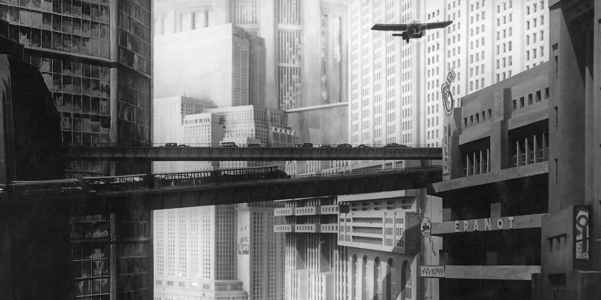 the huge futuristic city of Fritz Lang's "Metropolis", with cars, a train, and a plane