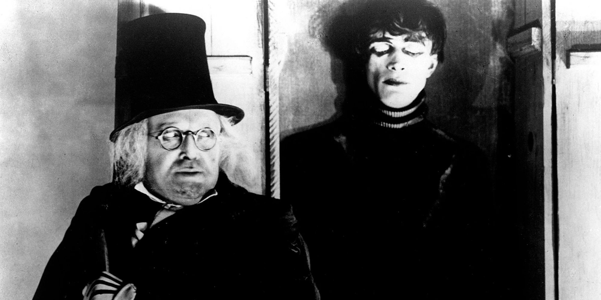 Dr Caligari with Cesare behind him in The Cabinet of Dr Caligari