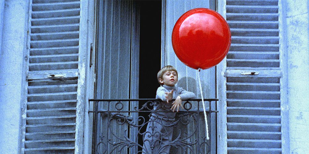 The seemingly sentient red balloon waits for his little boy outside the window