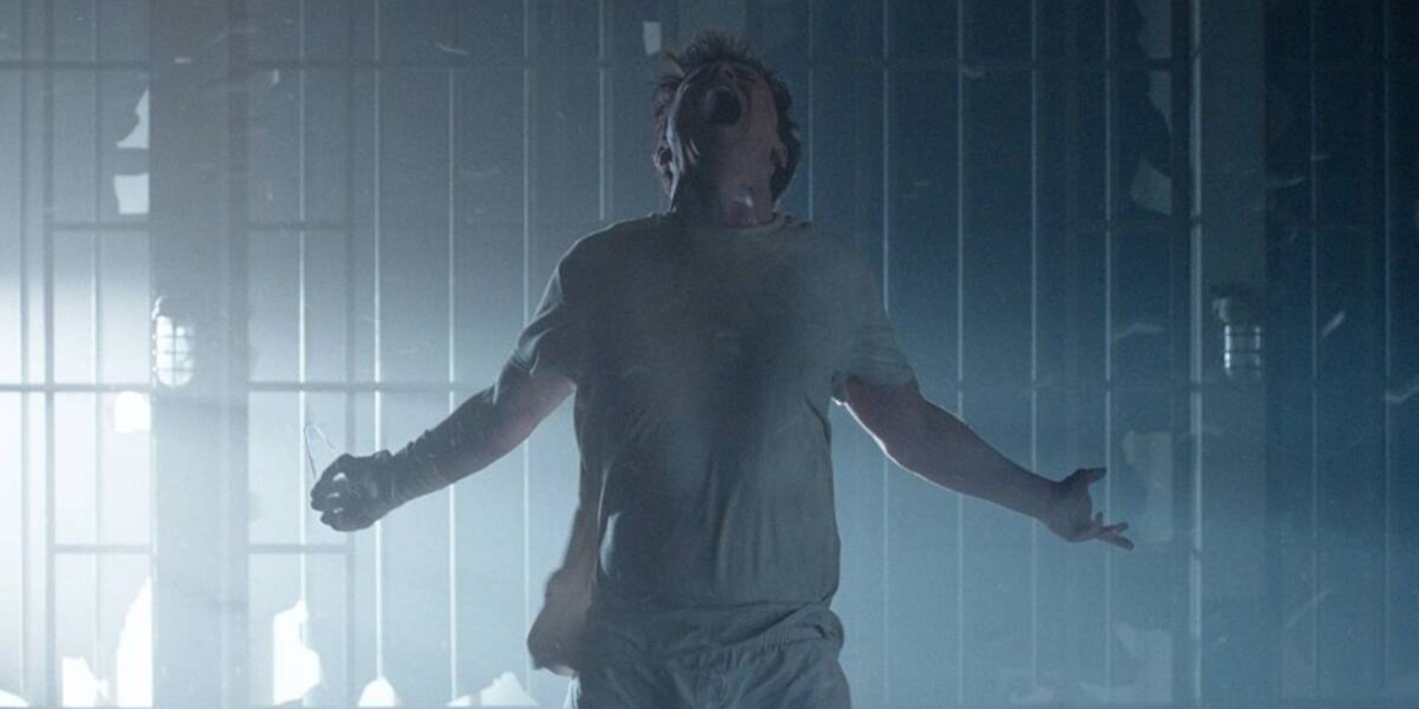 Arne Johnson, played by actor Ruairi O&rsquo;Connor, screaming while spreading his arms and throwing his head back in The Conjuring: The Devil Made Me Do It.