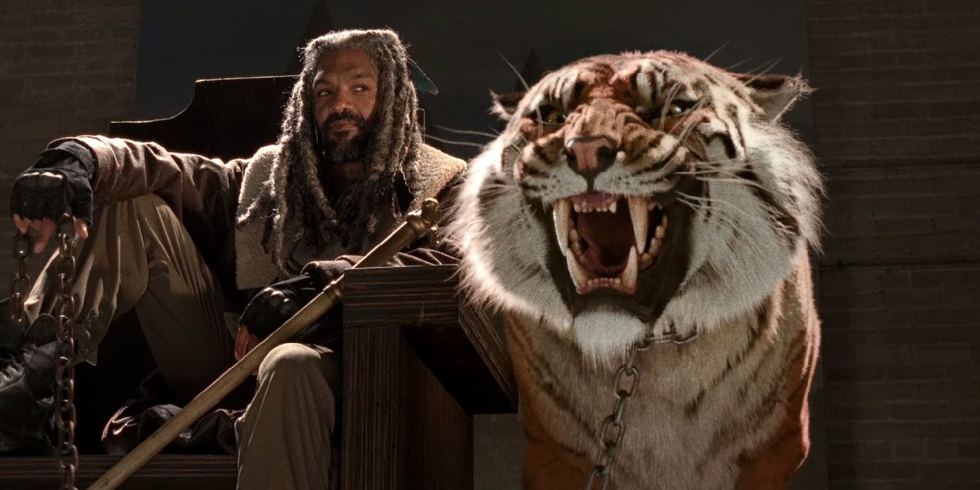 King Ezekiel sits on his throne alongside his pet tiger Shiva in 'The Walking Dead'