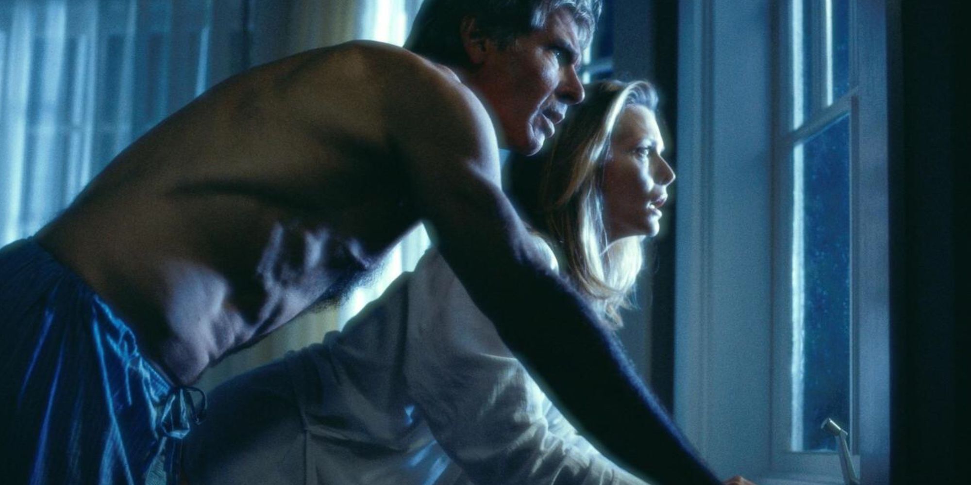Harrison Ford and Michelle Pfeiffer looking out window