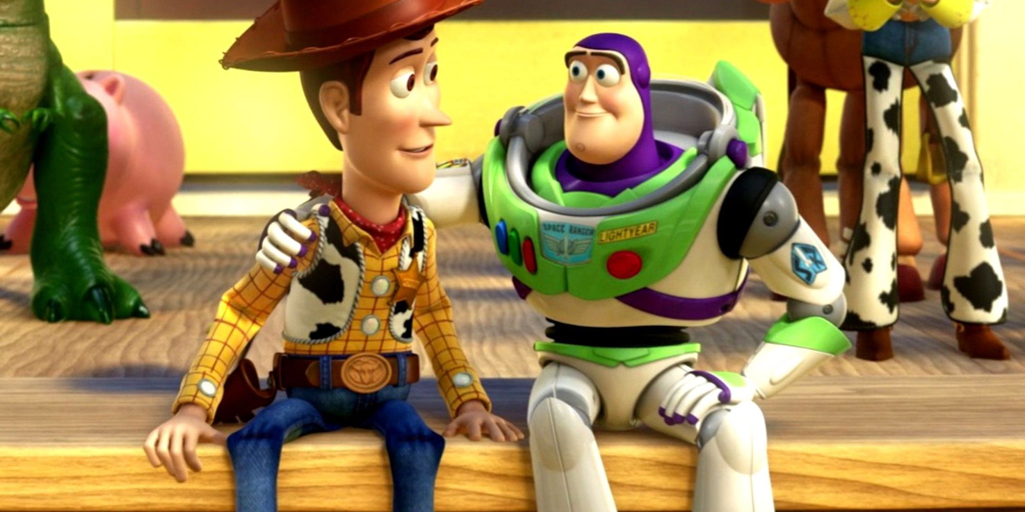 Woody and Buzz from "Toy Story 3" comforting each other after leaving Andy