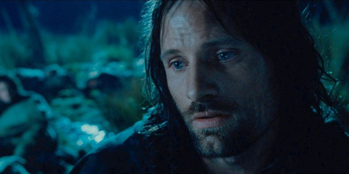 Aragorn sitting in a field at night singing 'The Song of Beren and Luthien'