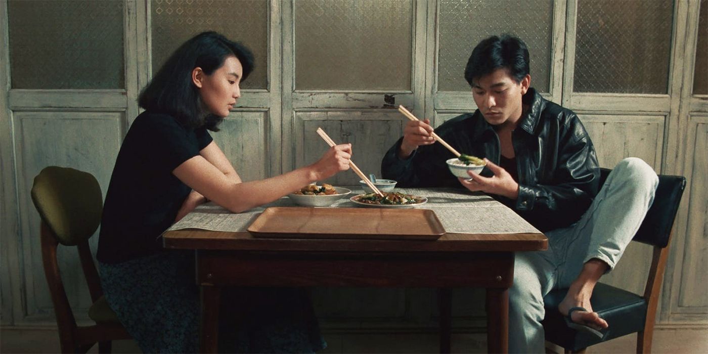 Andy Lau eating at a table with Maggie Cheung in As Tears Go By