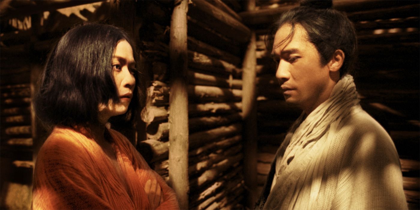 Tony Leung Chiu-Wai standing in front of Carina Lau in the Wuxia movie Ashes of Time