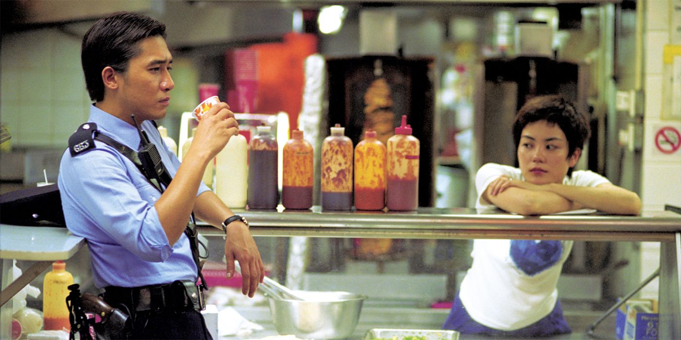 Faye Wong watching Tony Leung as he drinks coffee in Chungking Express