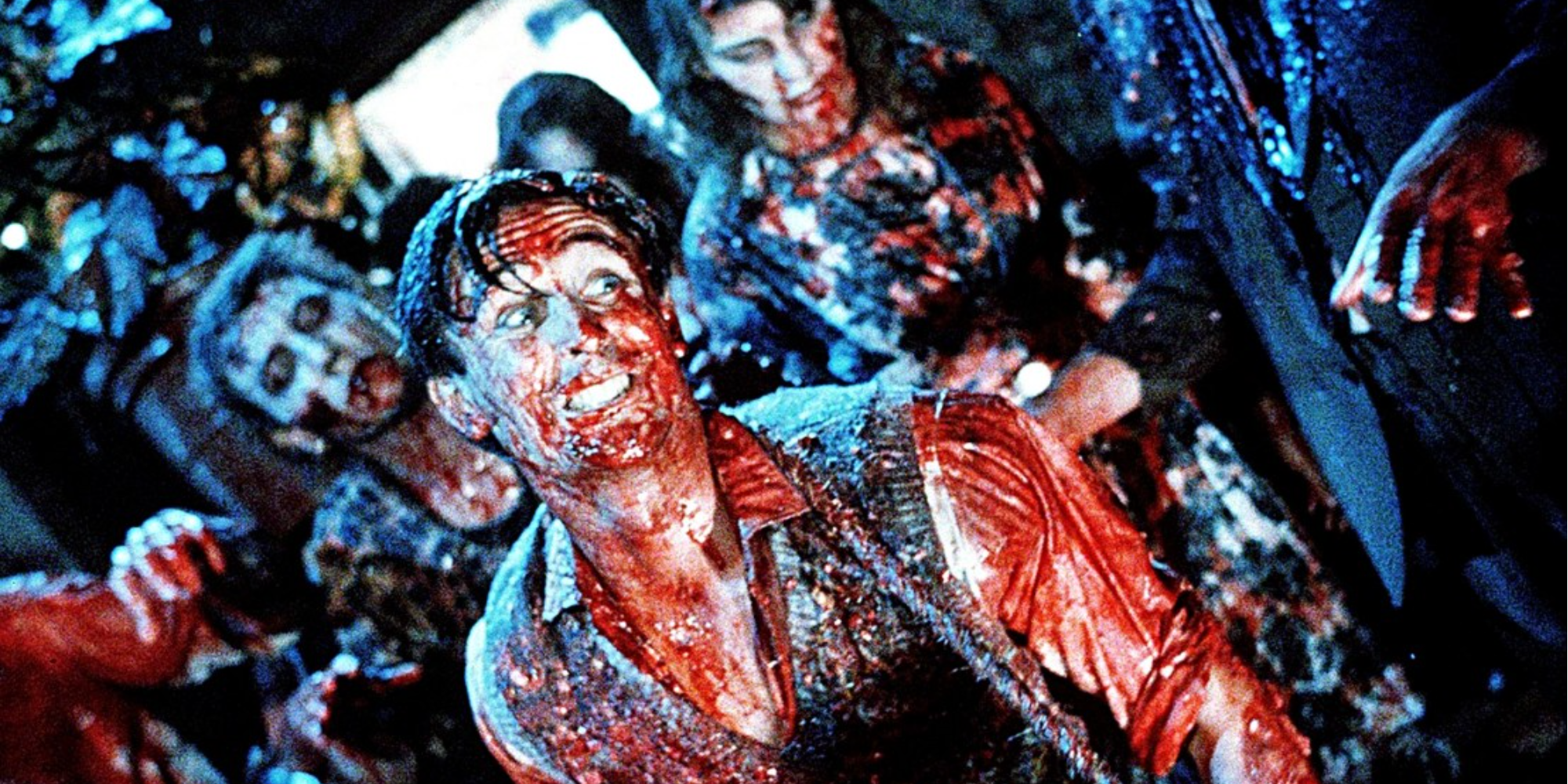 Lionel is covered in blood and surrounded by zombies 