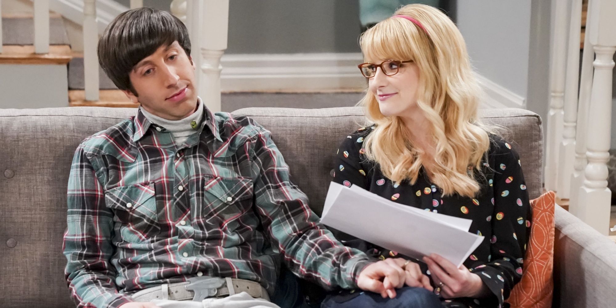 howard and bernadette sat on their couch in the big bang theory