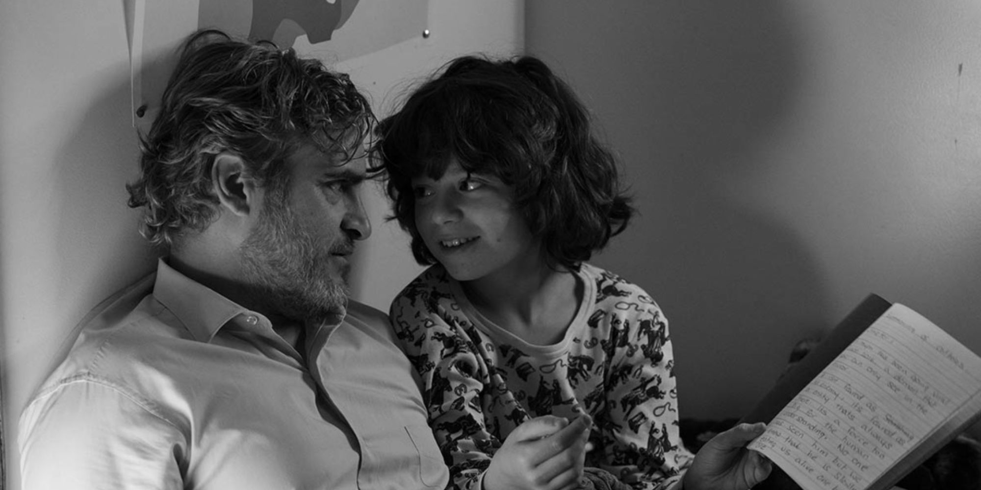 Joaquin Phoenix and Woody Norman looking at each other in C&rsquo;mon C&rsquo;mon