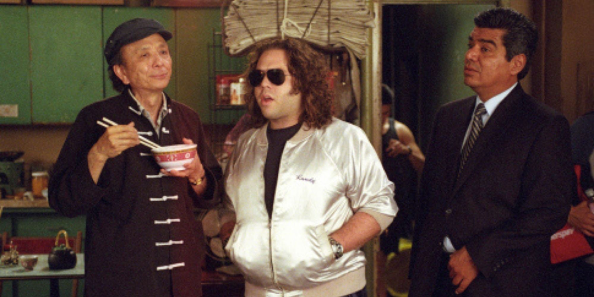 james hong in balls of fury with george lopez eats pork with man in sunglasses