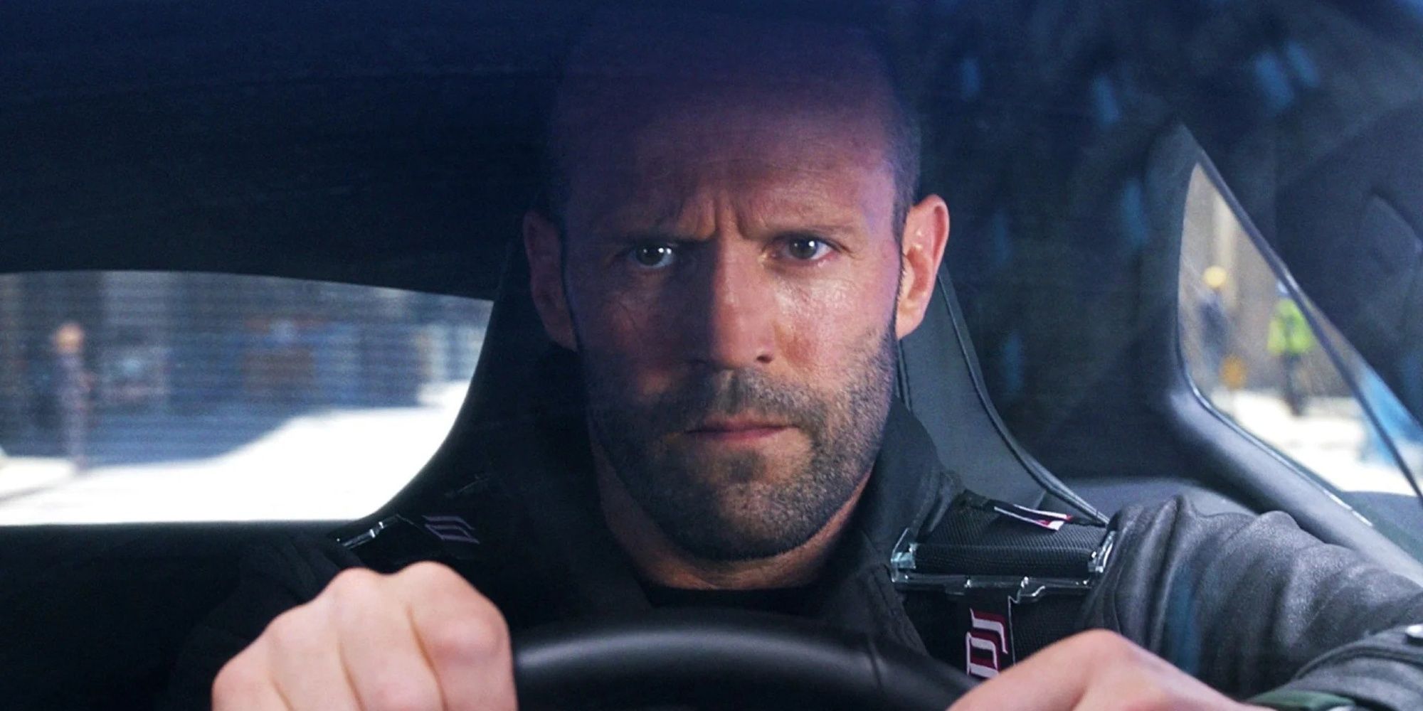 Jason Statham driving a car in Fast and the Furious