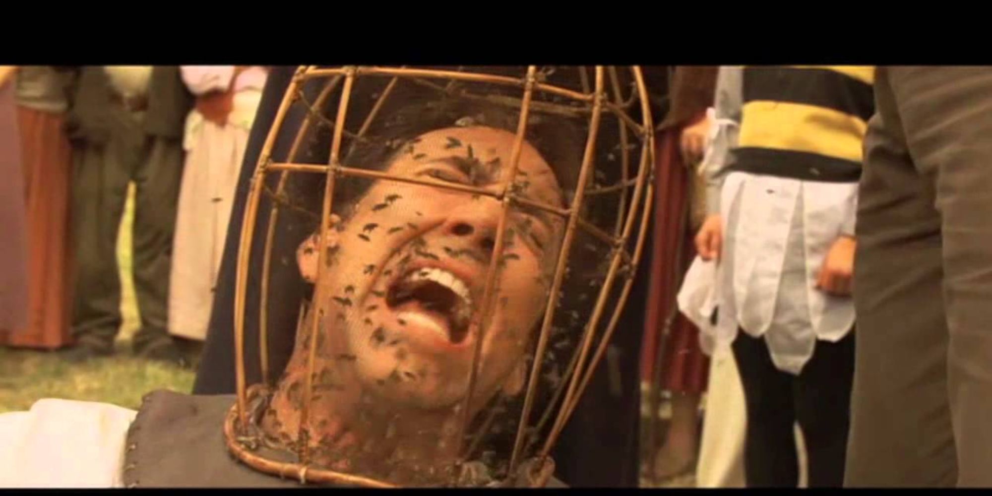 Nicolas Cage screams with a basket of bees on his head in The Wicker Man.