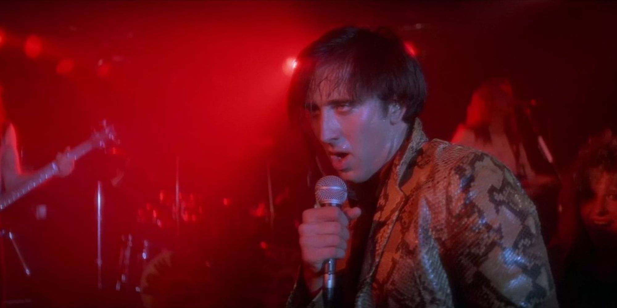 Nicolas Cage singing on stage in Wild at Heart