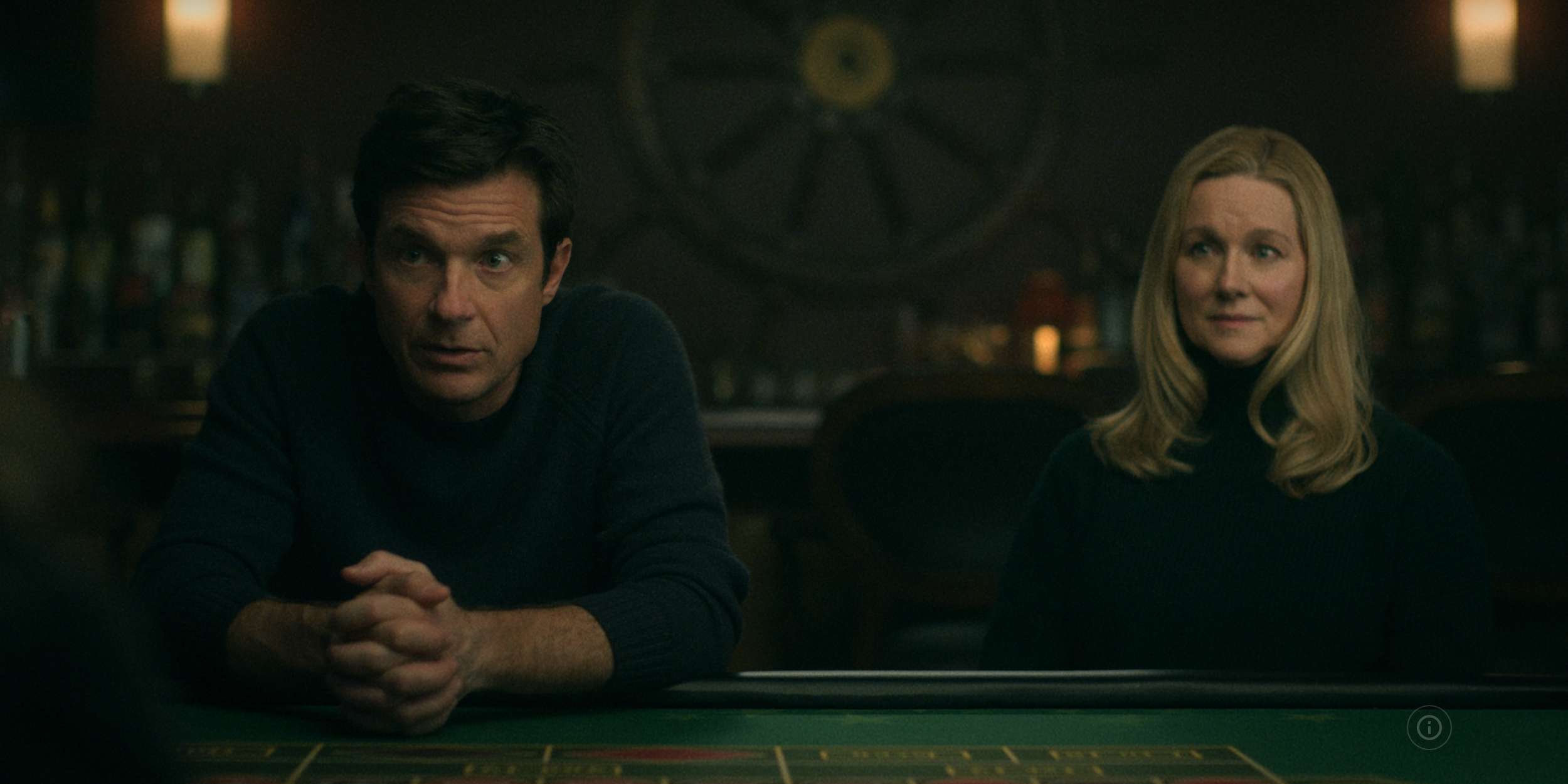 Marty and Wendy Byrd are seated at a poker table in the Netflix series Ozark