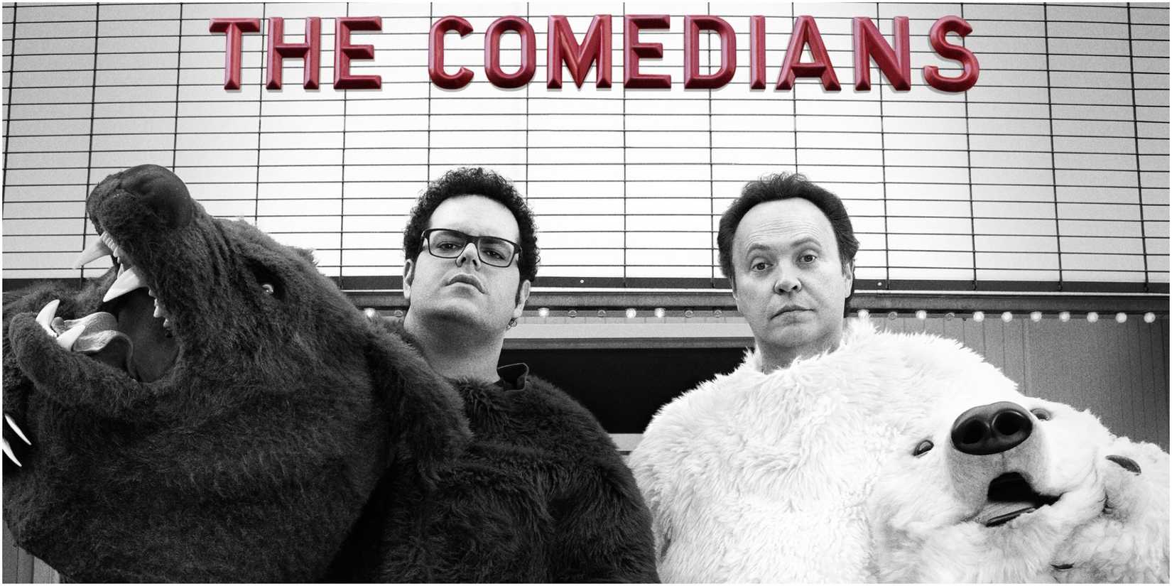 Josh Gad and Billy Crystal in bear costumes with a marquee that has the title of the series in The Comedians.