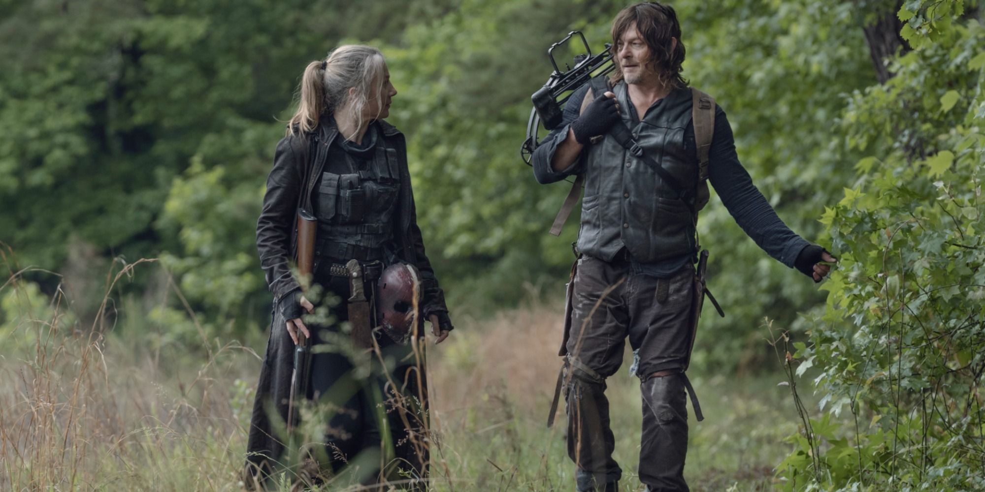 Daryl Dixon and Leah walk through the shrubbery together in 'The Walking Dead'