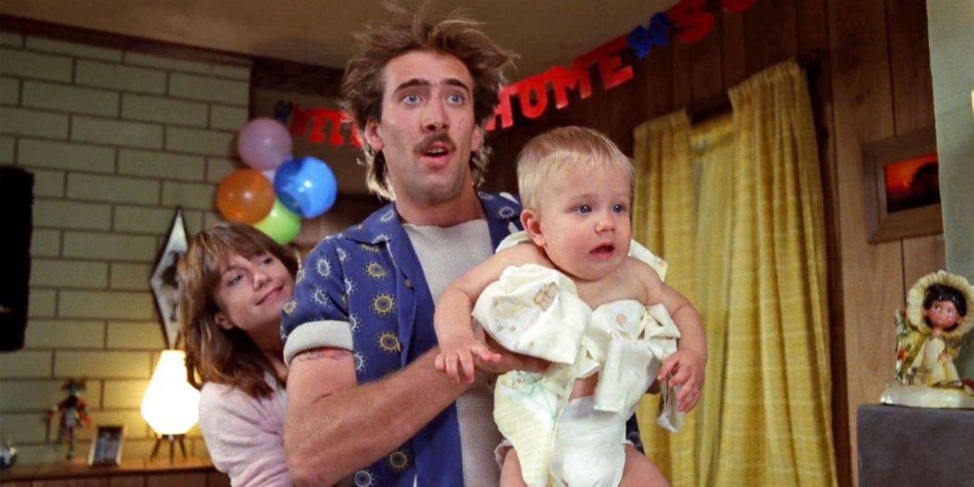 Nicolas Cage and Holly Hunter holding baby Arizona in Raising Arizona