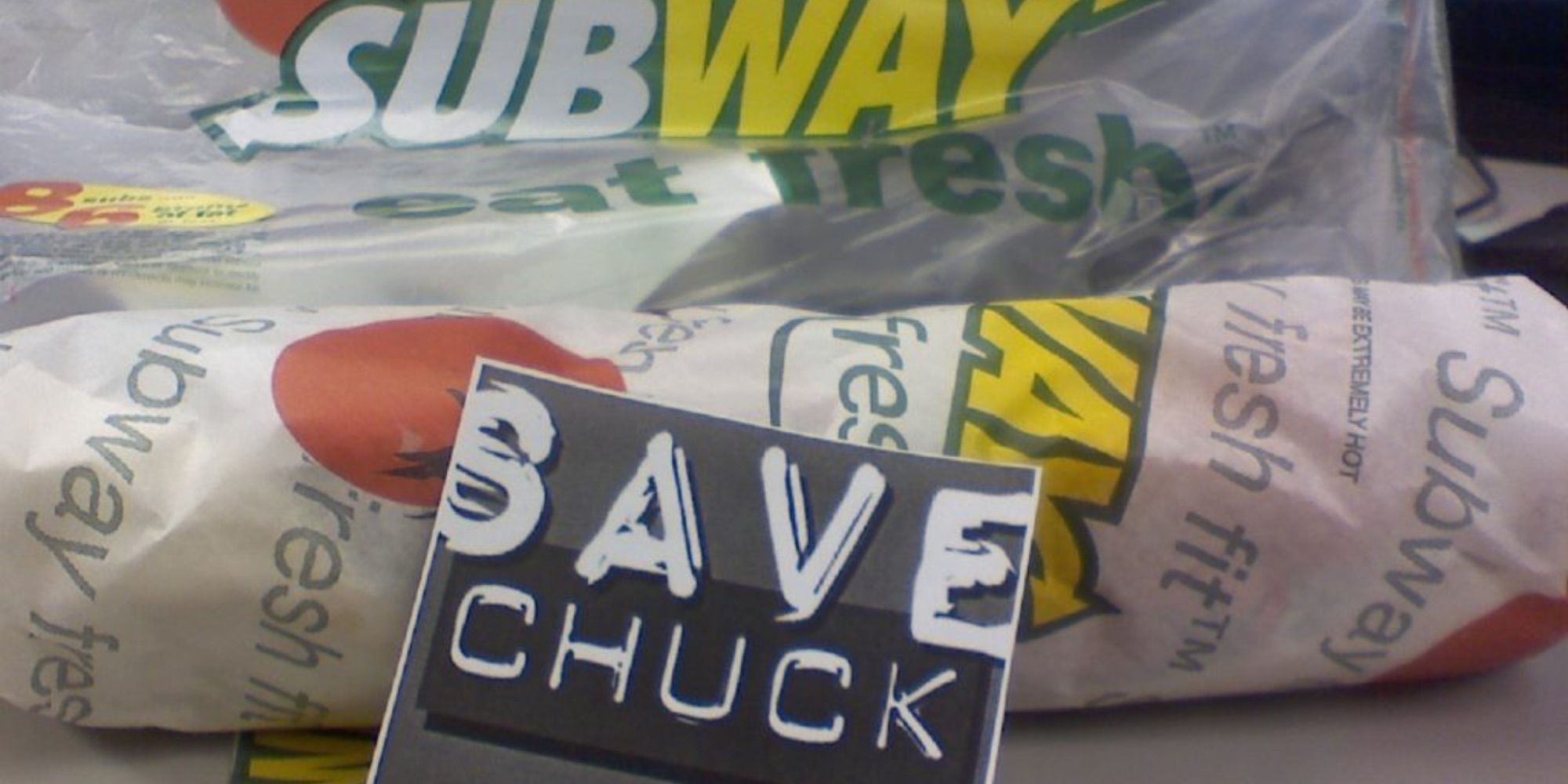 "save chuck" sign next to subway sandwich 