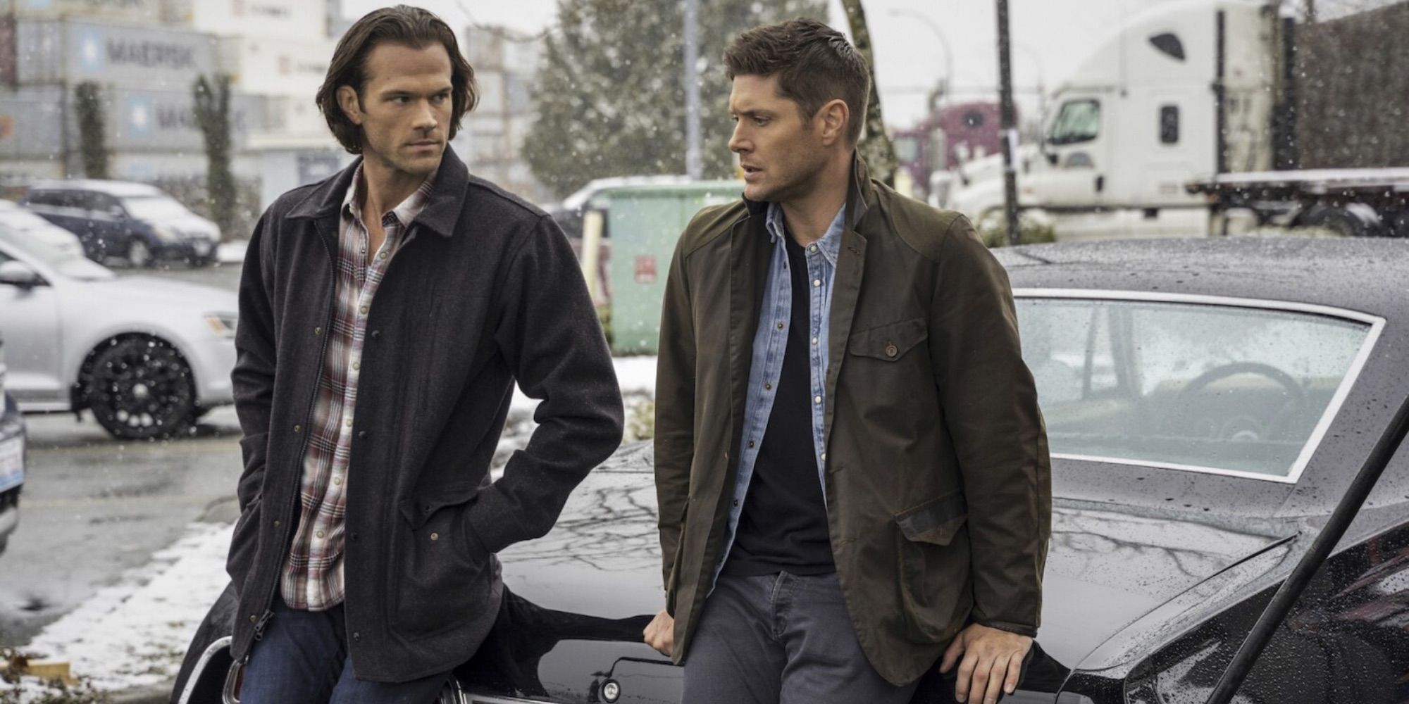 Sam and Dean Winchester sitting on the Impala