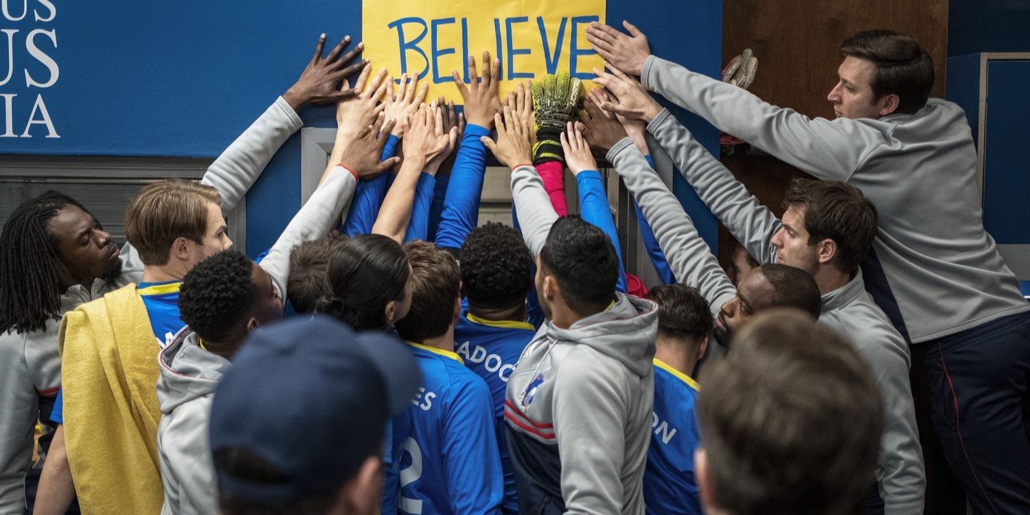 ted lasso locker room isaac and richmond team tap the believe poster during halftime