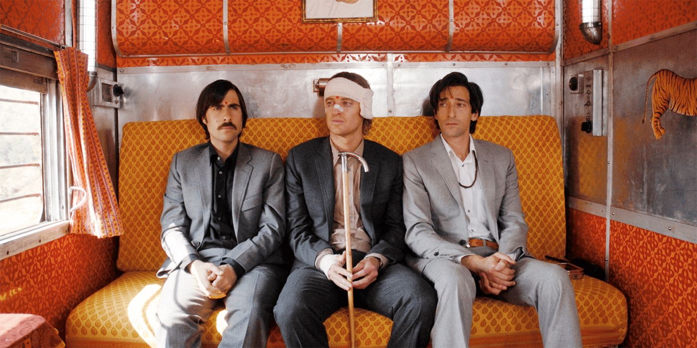 Jack, Francis, and Peter sitting together looking tired in The Darjeeling Limited