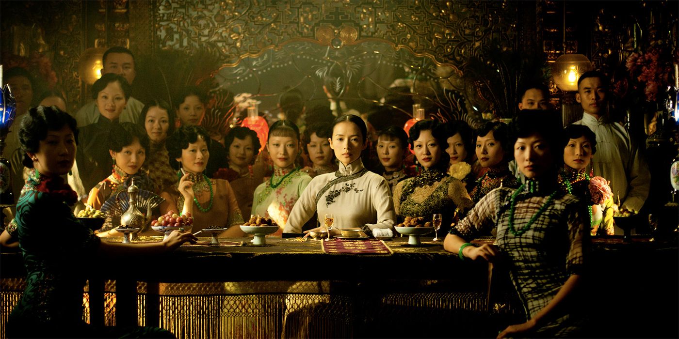 Zhang Ziyi sitting at a table with other women during a celebration in The Grandmaster
