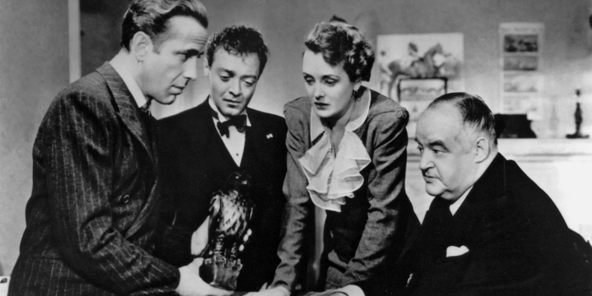 Group of people containing Humphrey Bogart as Sam Spade and others in 'The Maltese Falcon'