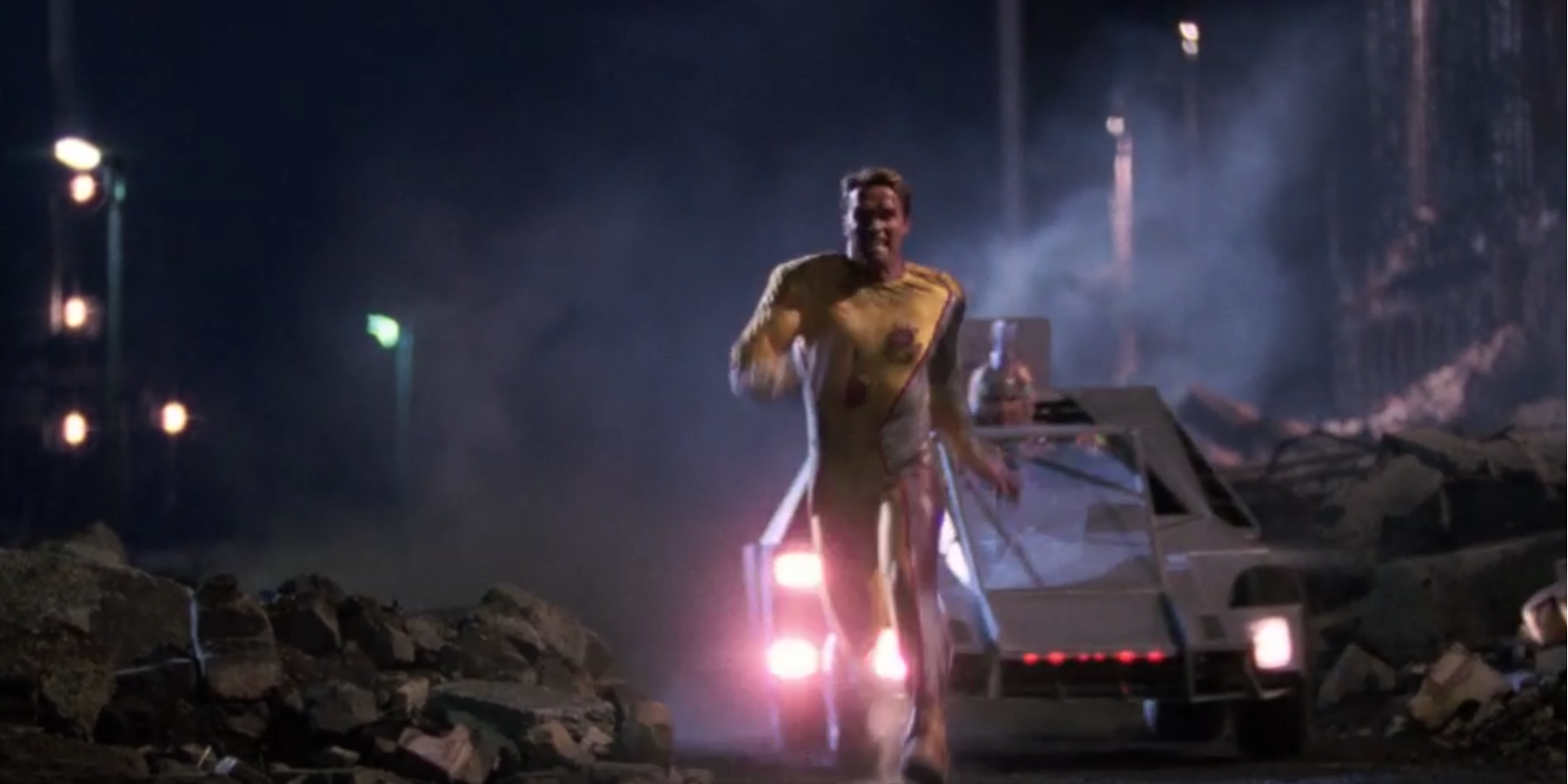 Arnold Schwarzenegger as Ben Richards running for his life as he is being chased in The Running Man
