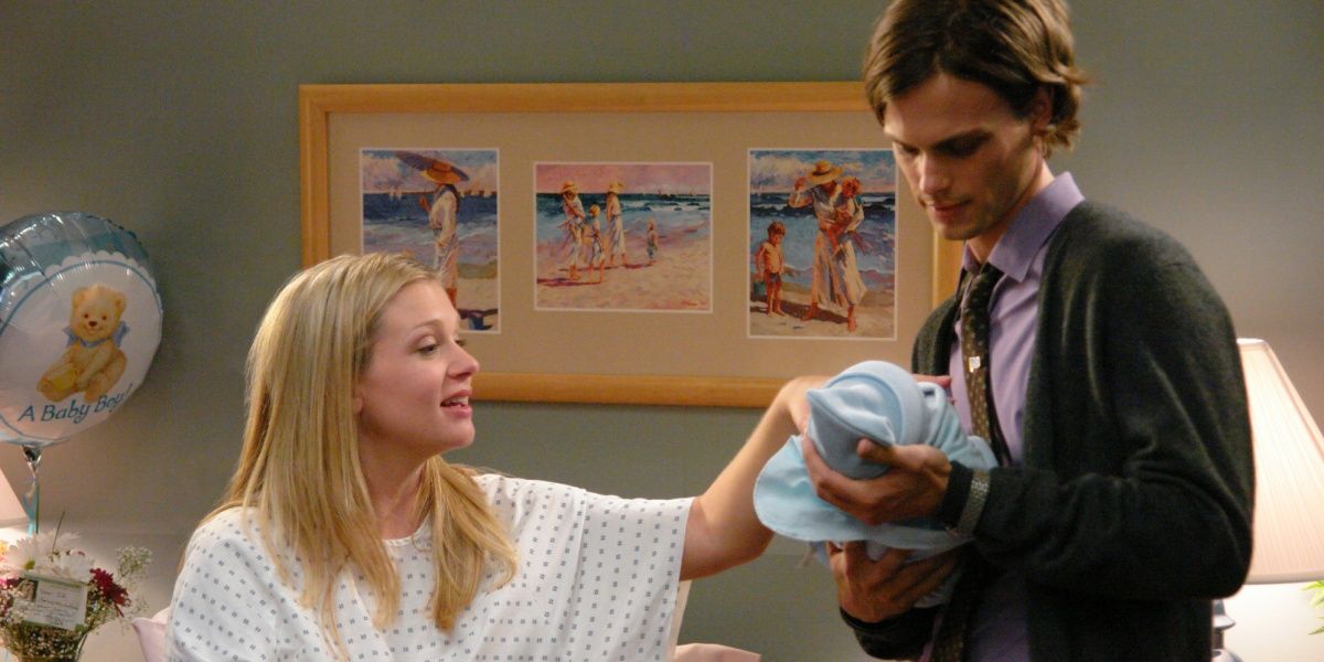 Criminal Minds characters J.J. (A.J. Cook) and Spencer Reid (Matthew Gray Gubler) looking at J.J.&rsquo;s newborn son Henry