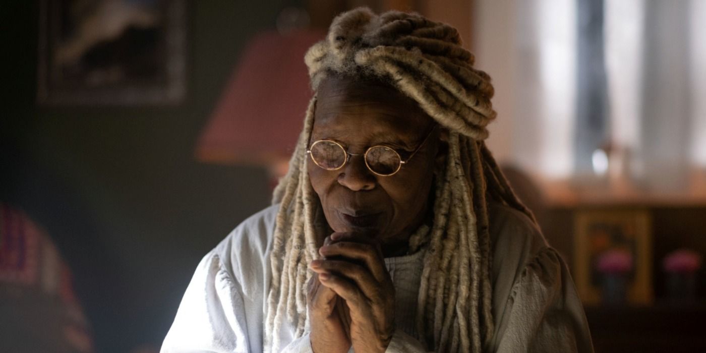 Whoopi Goldberg, hands together, looking pensive in The Stand.
