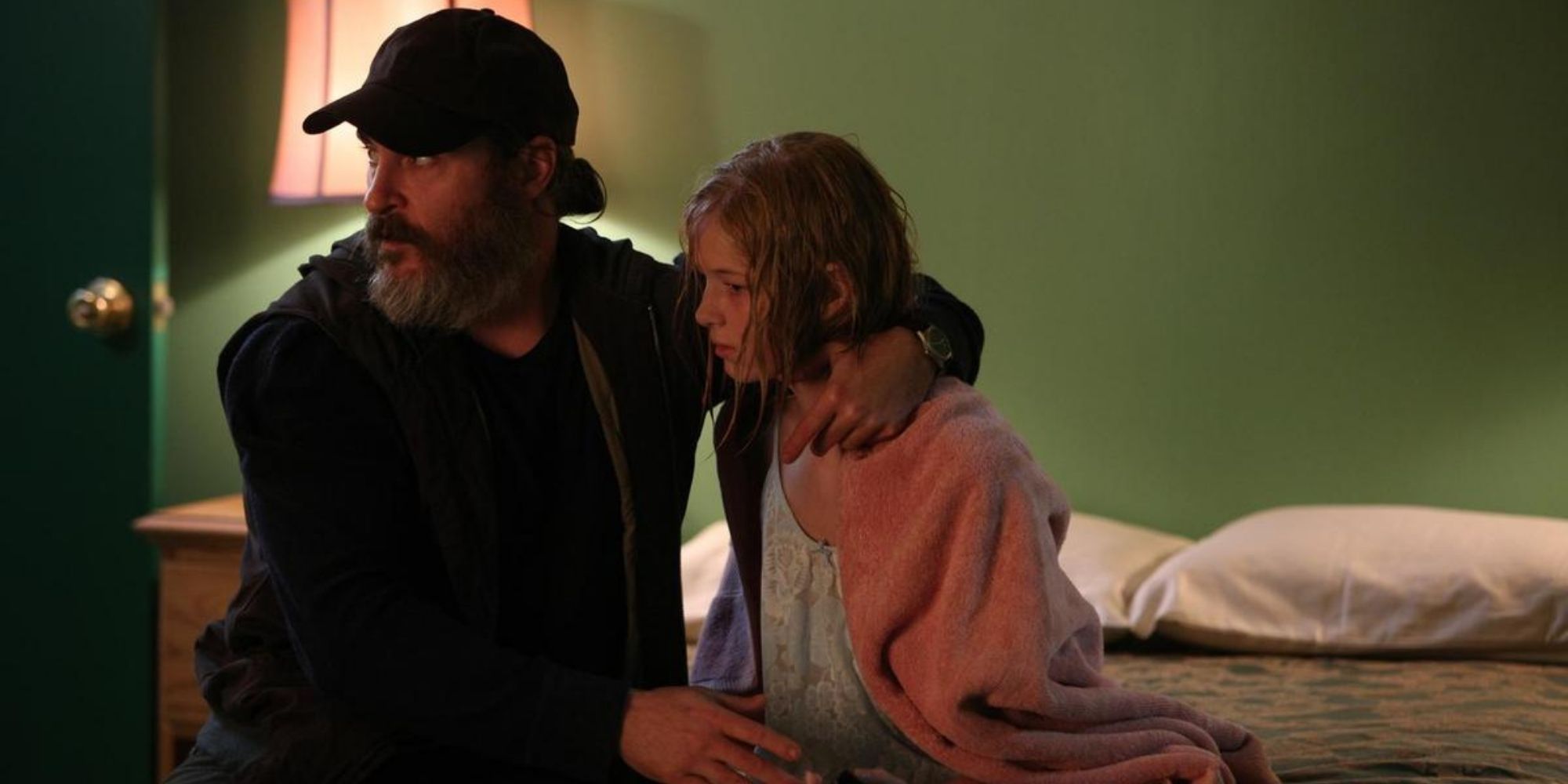 Joaquin Phoenix comforts girl in You Were Never Really Here