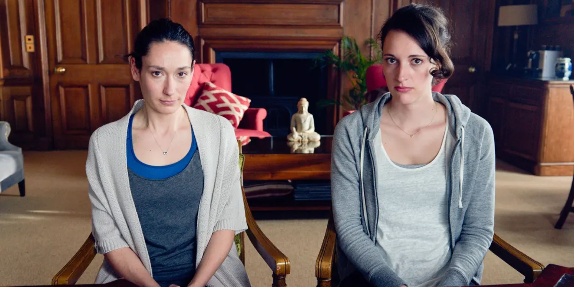 Sian Clifford and Phoebe Waller-Bridge as Claire and Fleabag looking at the camera with confused expressions in Fleabag